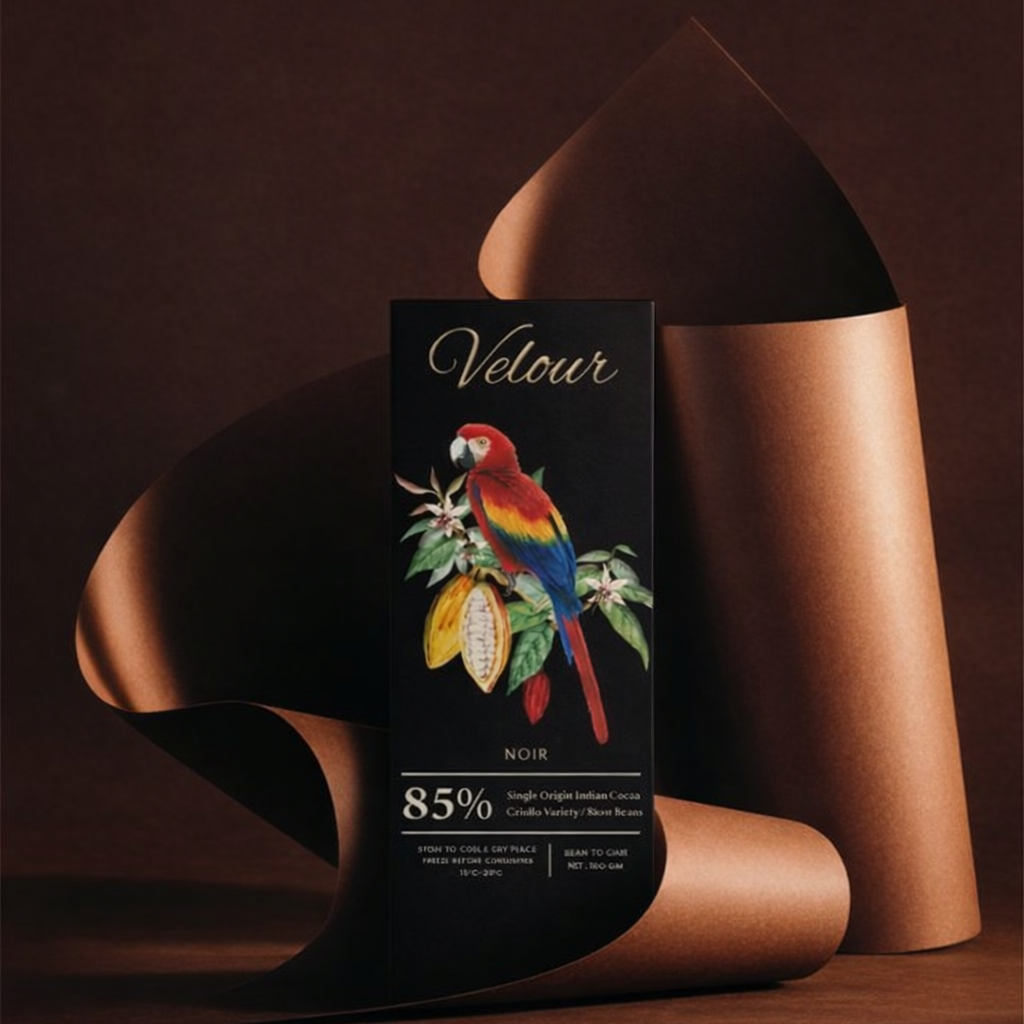 Chocolate bar with 'Velour' branding and a parrot illustration on a brown background